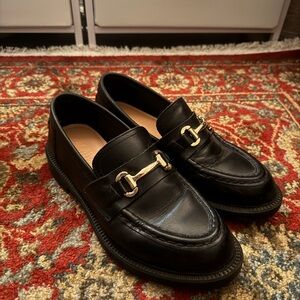 Classic Black Waterproof Loafers with Gold Accent